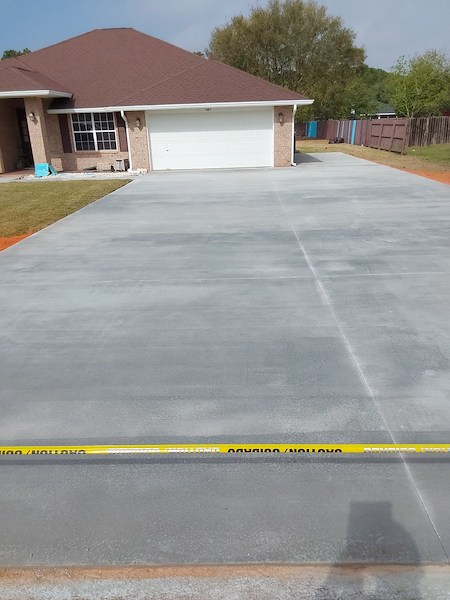Crestview concrete driveway installation overcoming clay soil expansion to prevent shifting slabs