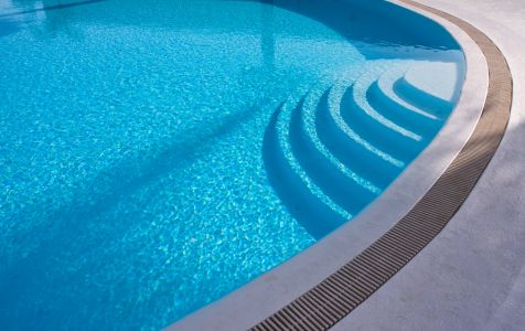 Navarre pool deck installation overcoming sugar sand shifting and saltwater splash
